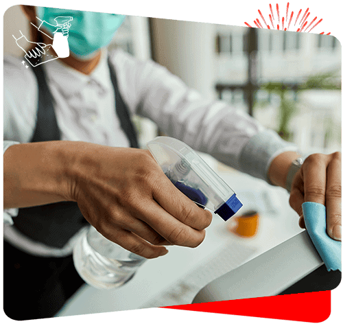 Professional cleaning team sanitizing surfaces with disinfectant spray for a germ-free environment.